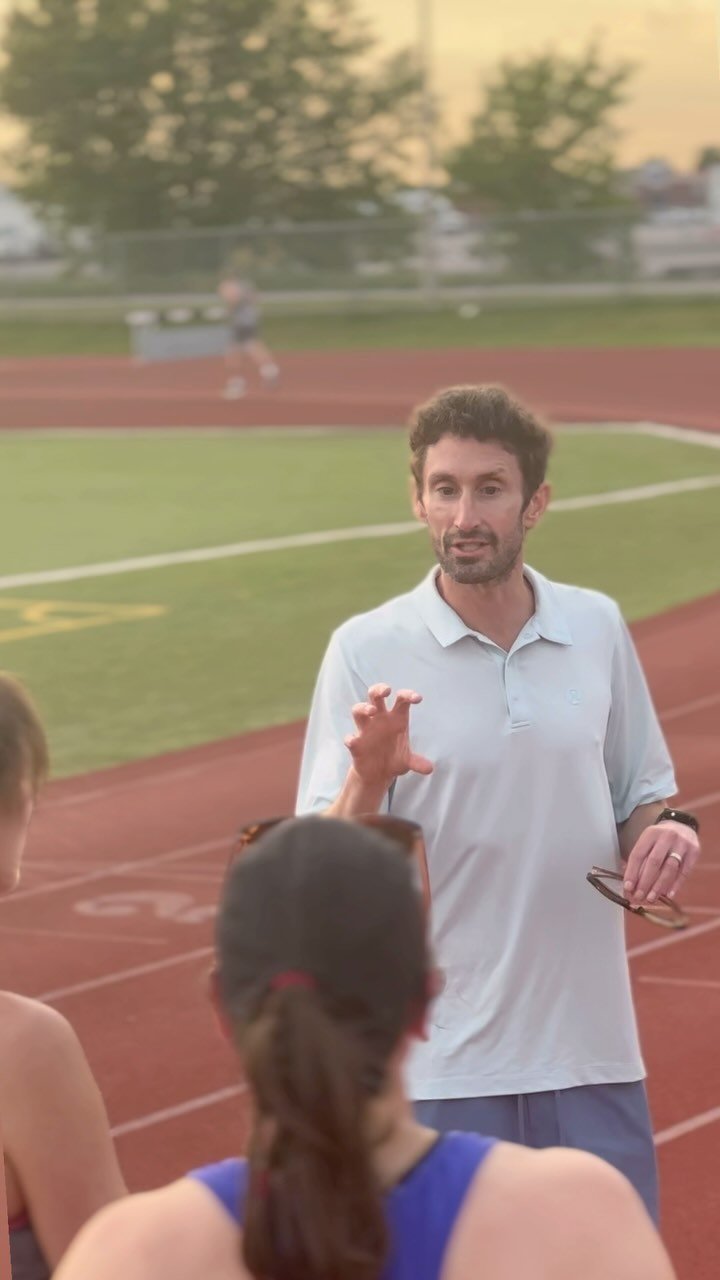 Kevin Coffey coaching runners at the track